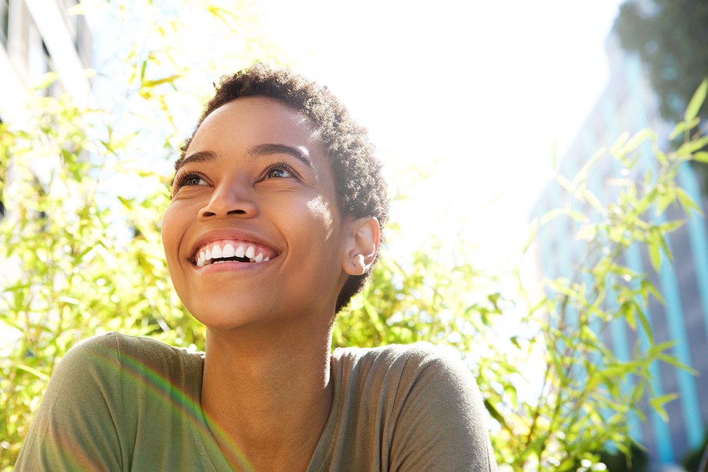 person smiling outside after dental checkup at odonto dental in aurora colorado