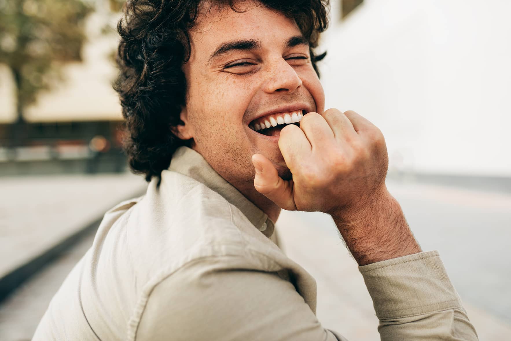 man laughing during emergency dental care appointment at odonto dental