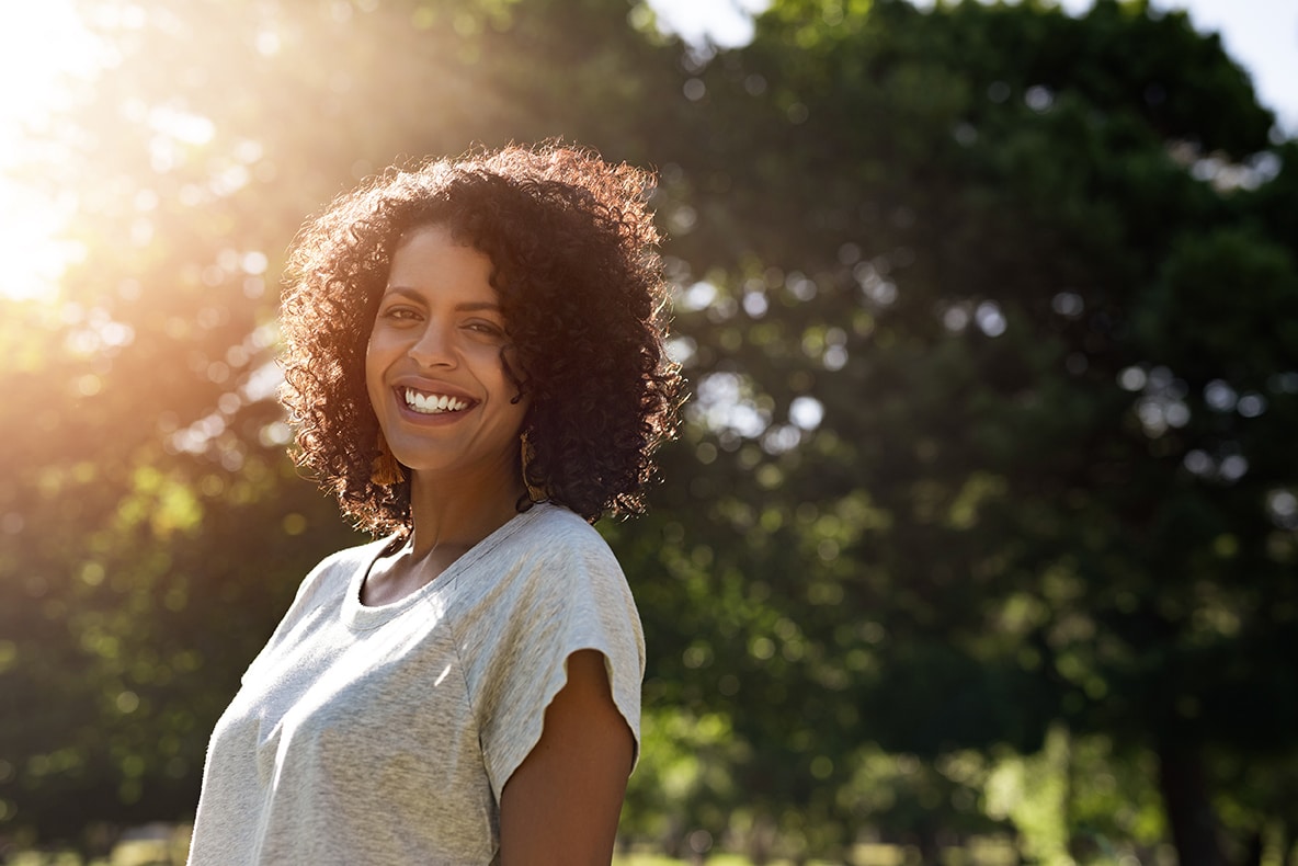 woman smiling while showing her teeth in aurora colorado usa