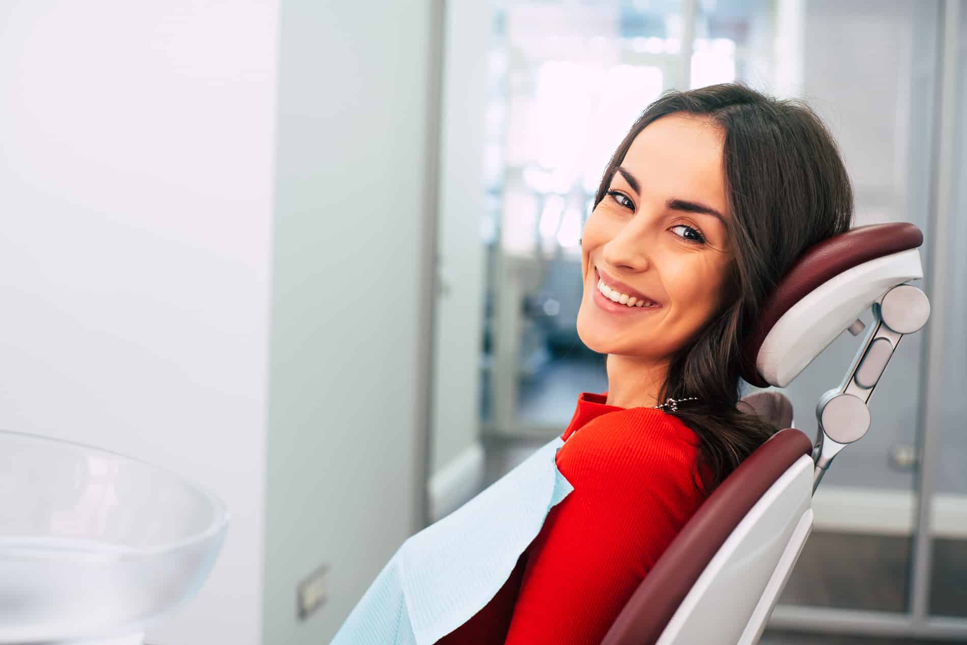 Woman smiling at the dentist cancer free after oral cancer screening in Aurora CO